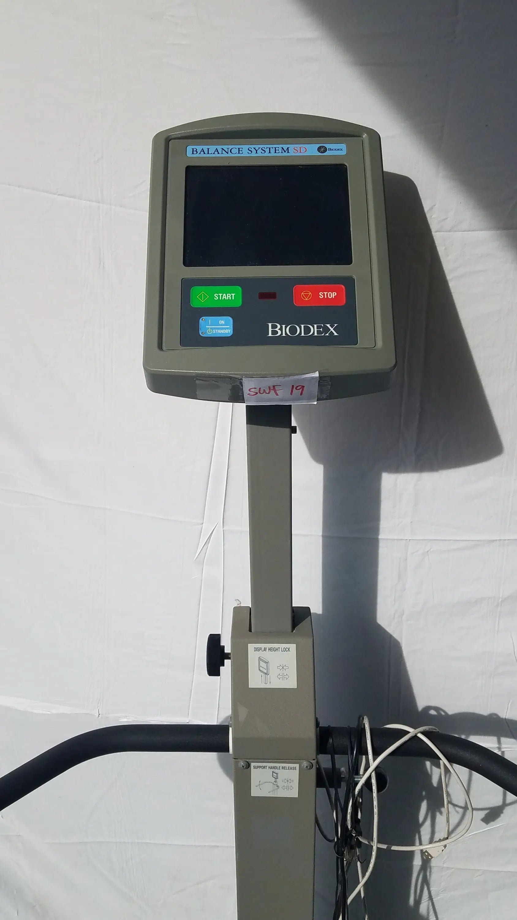 Gray biodex 950-300 balance system sd 3d exercise machine with digital display and control buttons for balance assessment serial number 0705499