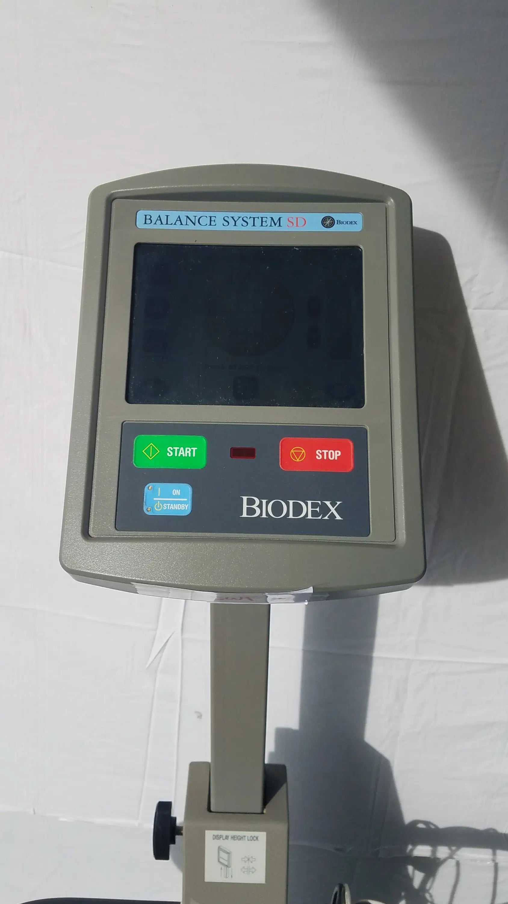 Gray biodex 950-300 balance system sd with digital display and control buttons for balance assessment serial number 0705499