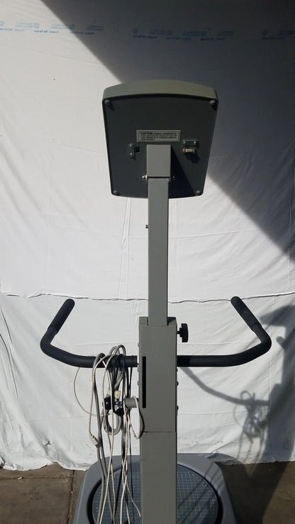 Gray metal biodex 950-300 balance system exercise bike with black handlebars and digital display panel serial number 0705499