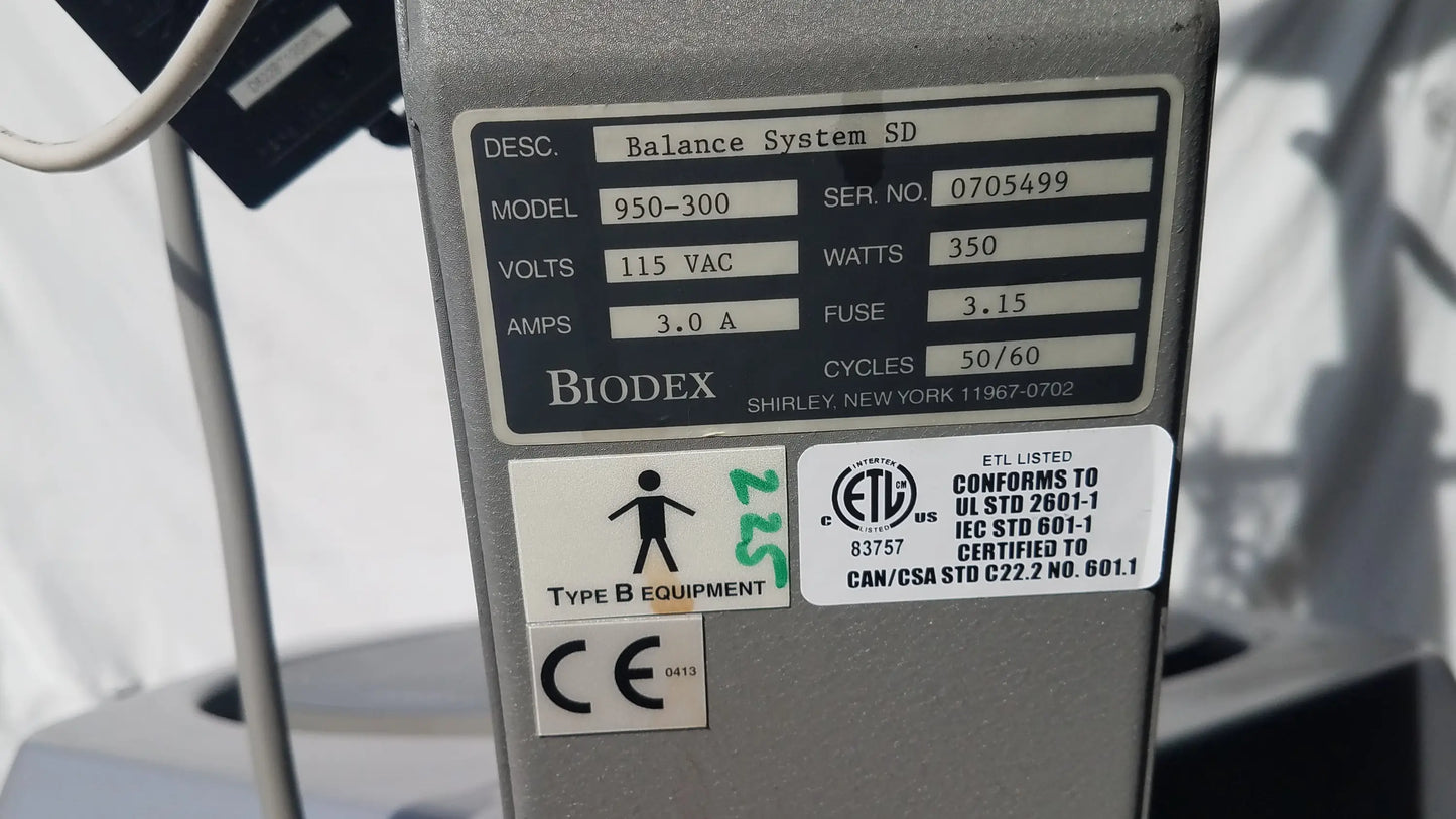 Gray metallic biodex 950-300 balance system sd with technical specifications label showing serial number for balance assessment