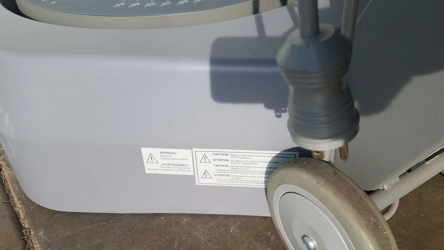 Gray plastic biodex 950-300 balance system sd with circular dial and serial number for balance assessment on wheeled base