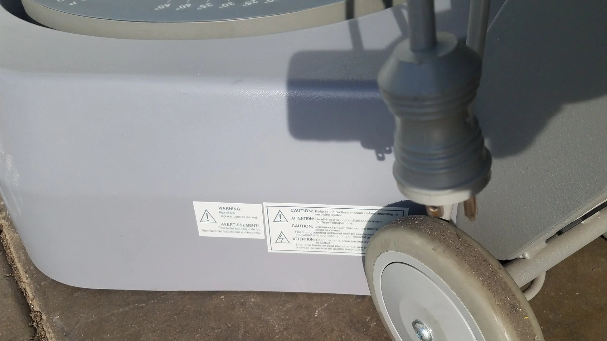Gray plastic biodex 950-300 balance system sd with circular dial and serial number for balance assessment on wheeled base