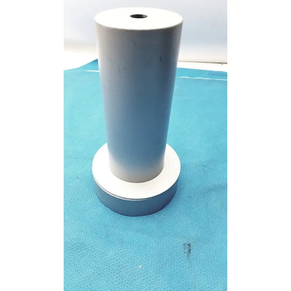 White cylindrical biodex medical systems wipe test counter with central hole and matching circular base for systems wipe test