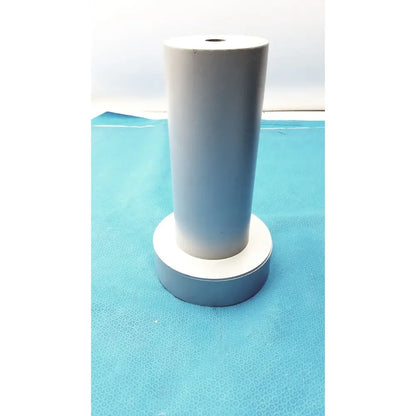 White cylindrical biodex medical systems wipe test counter with circular base matte finish and central top hole