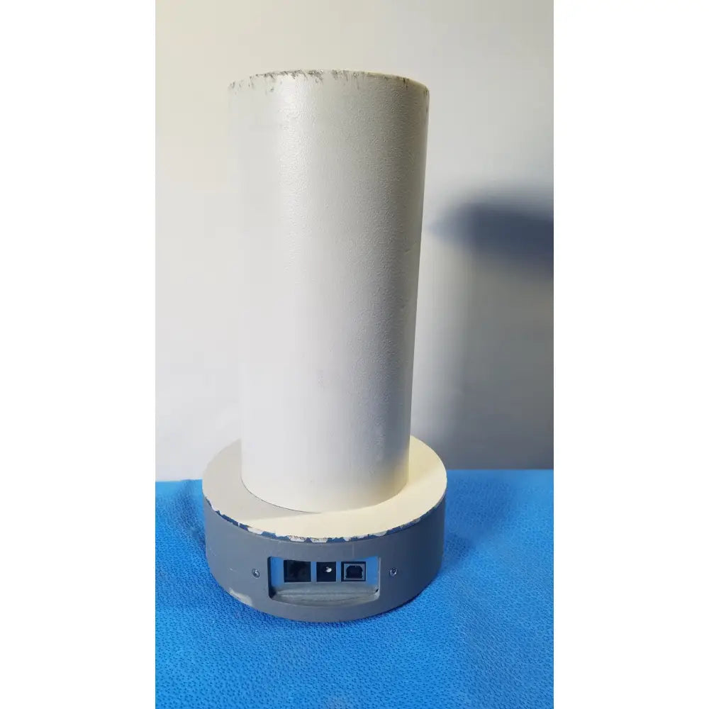 White cylindrical biodex well counter 187-602 base with gray platform, ethernet ports, power button for reuse medical settings