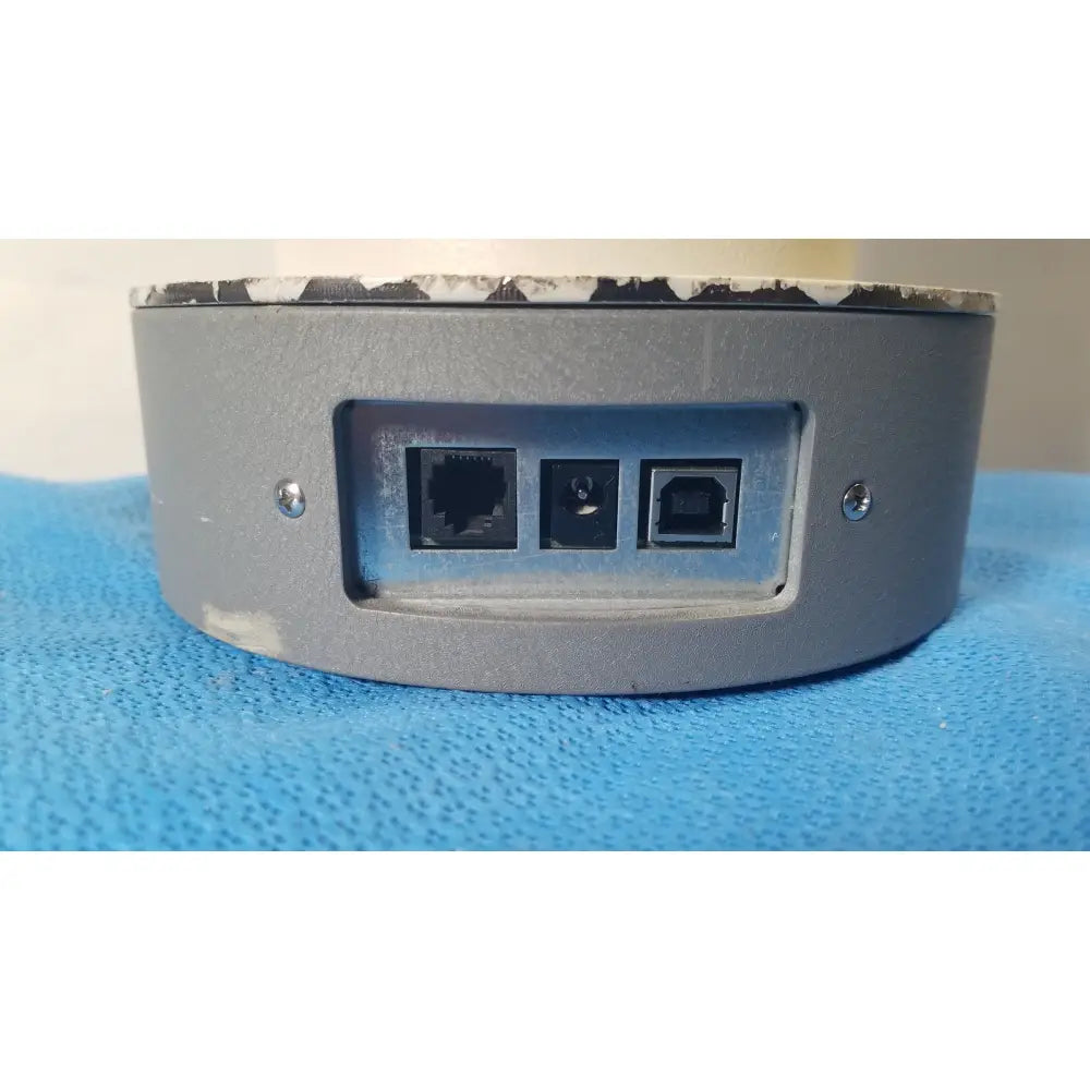 Back side of a gray cylindrical biodek well counter 187-602 network device with ethernet usb type-b and circular ports for reuse medical