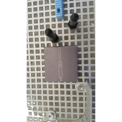 A matte gray summit medical ua2438 instrument sterilization tray with a white pen drawing and the number 8 on its surface