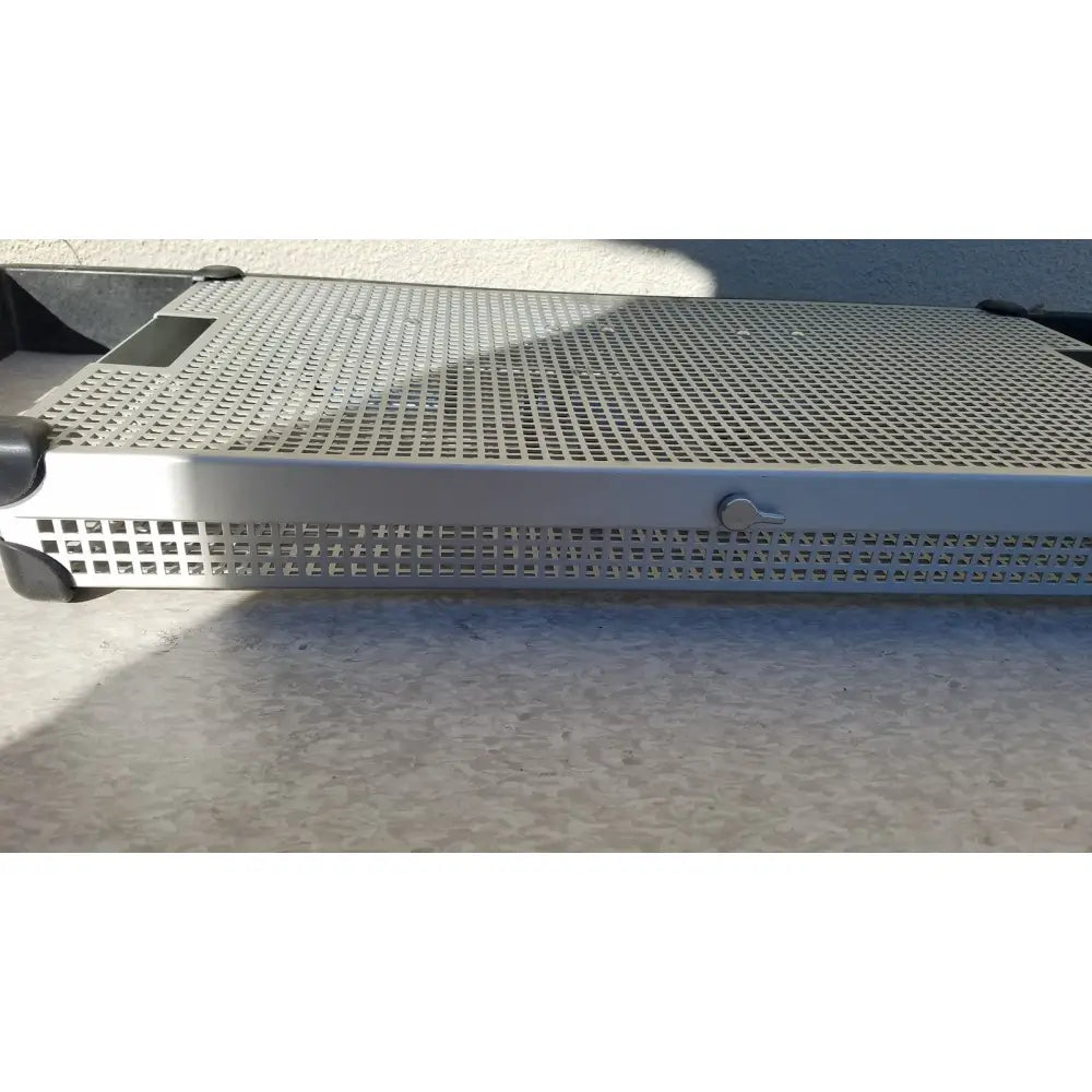 Silver perforated metal instrument sterilization tray with black plastic corners and handle by summit medical ua2438
