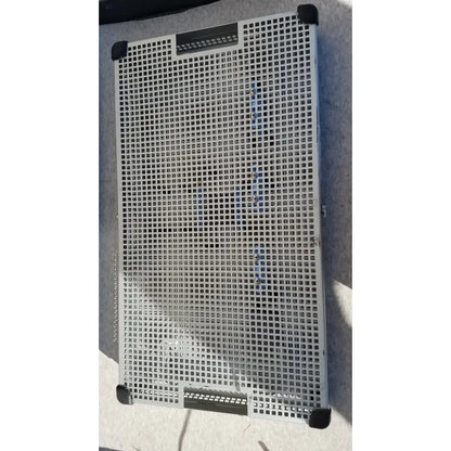 Gray plastic industrial crate with grid pattern and black corner protectors summit medical ua2438 instrument tray
