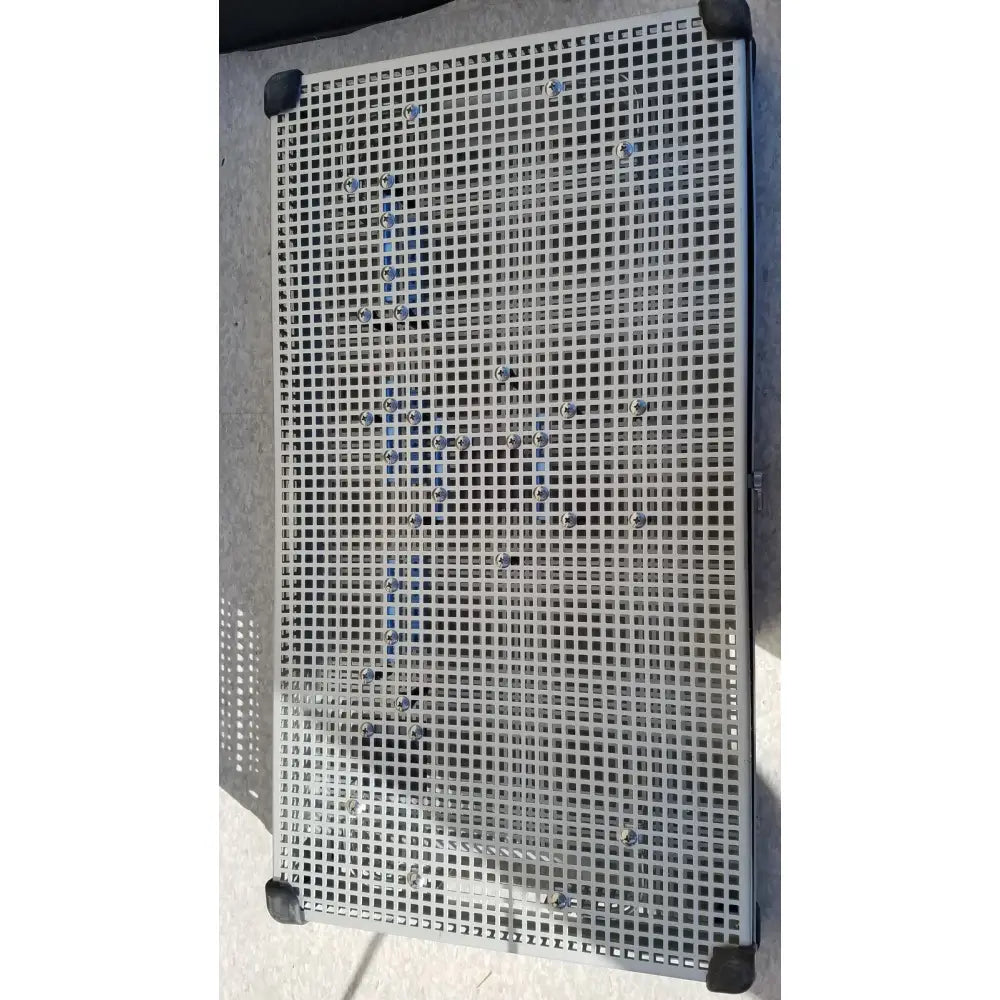 Silver metal grid sterilization tray with black corner protectors for summit medical ua2438 instrument use
