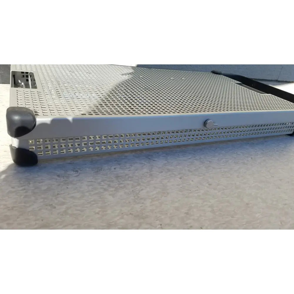 Silver perforated metal server rack with black corner protectors in summit medical ua2438 instrument sterilization tray