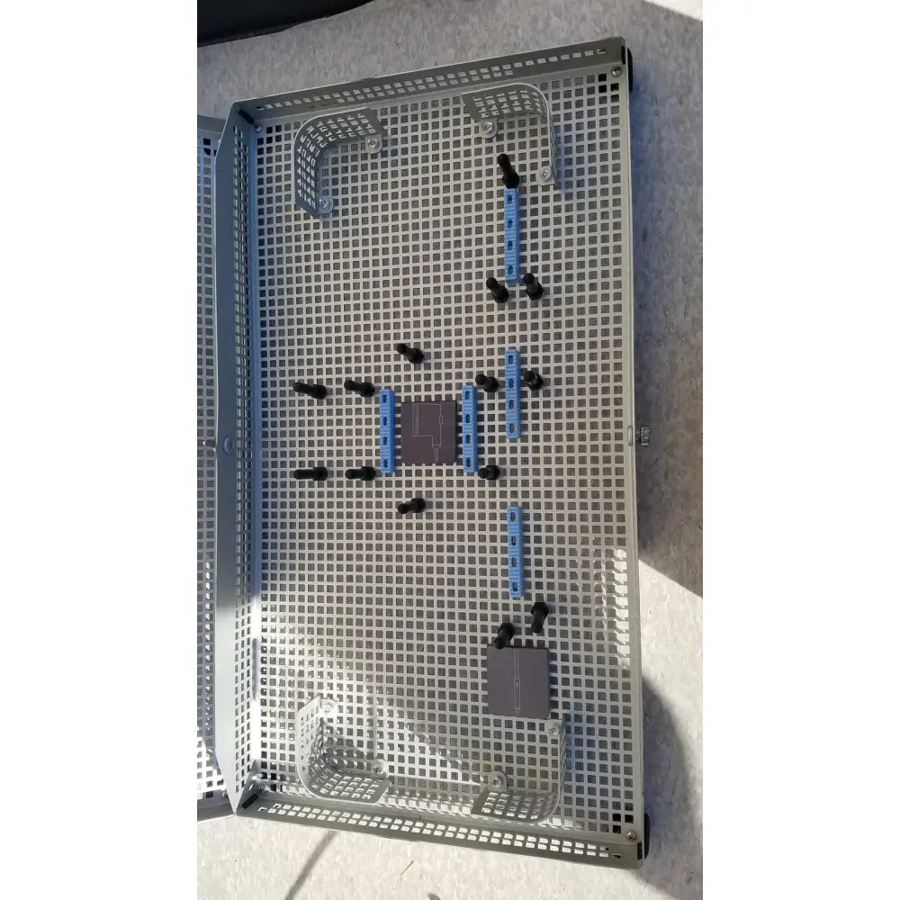 Gray metal grid storage tray with blue and black plastic components for summit medical ua2438 instrument sterilization
