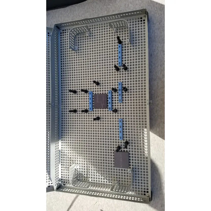 Gray metal grid storage tray with blue and black plastic components for summit medical ua2438 instrument sterilization