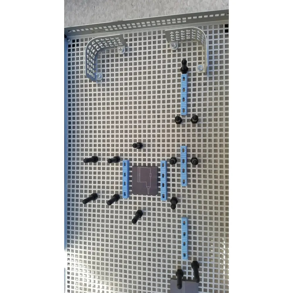 Gray perforated metal panel with blue and black connectors in summit medical ua2438 instrument sterilization tray