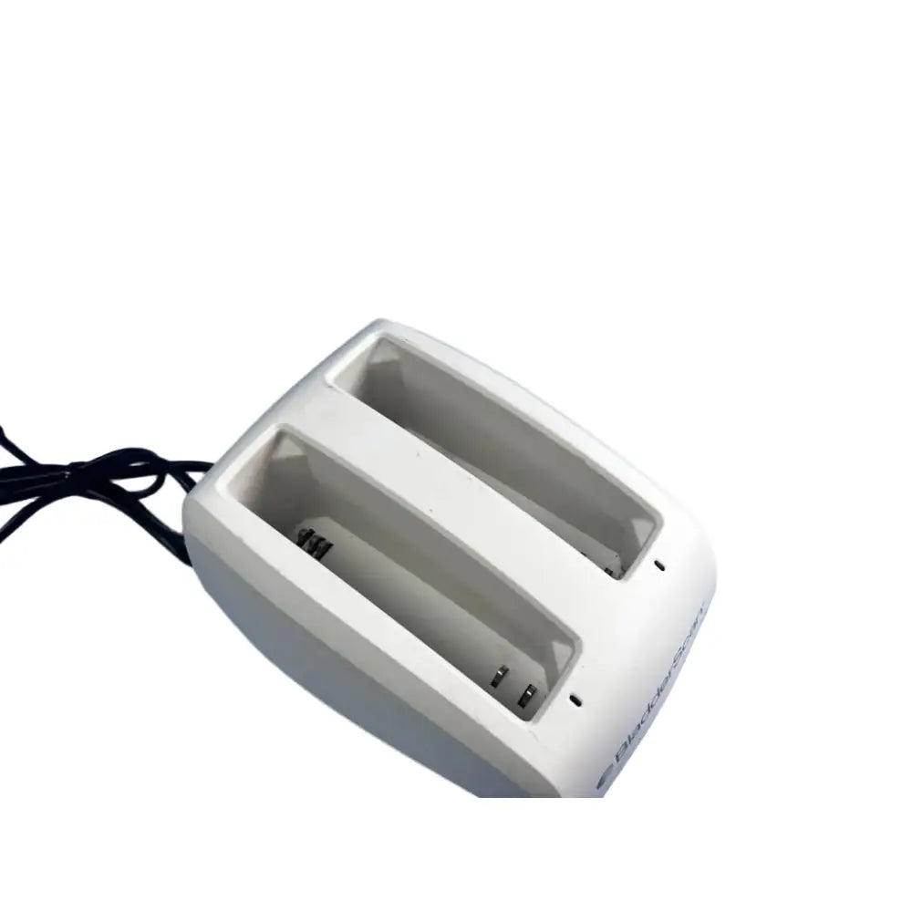 White plastic bladderscan battery charger 0570-0193 with dual slots and black power cord for efficient charging