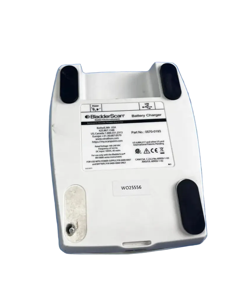 White plastic bladderscan battery charger with black rubber feet and label for reuse medical device 0570-0193
