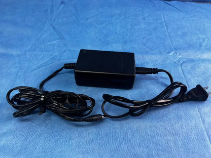 Black rectangular bladderscan battery charger 0570-0193 with coiled cables and standard plug for reuse medical devices