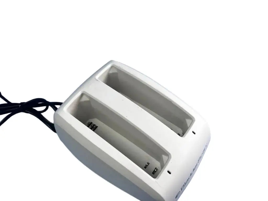White plastic bladderscan battery charger 0570-0193 with dual slots and black power cord for efficient charging