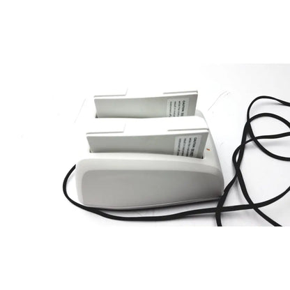 White plastic dual-slot bladderscan charging cradle verathon 0400-0066 with black power cords and GPSU15B adapter