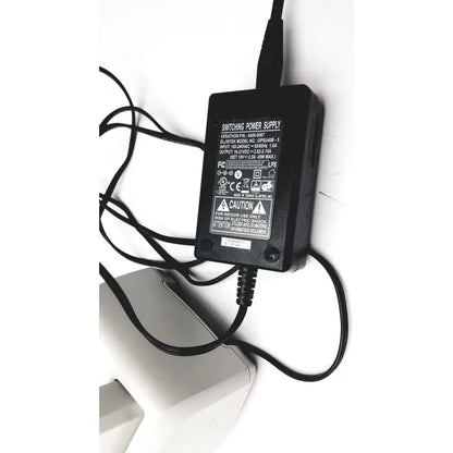 Black plastic bladderscan charging cradle verathon 0400-0066 with coiled cables and GPSU15B adapter backside view