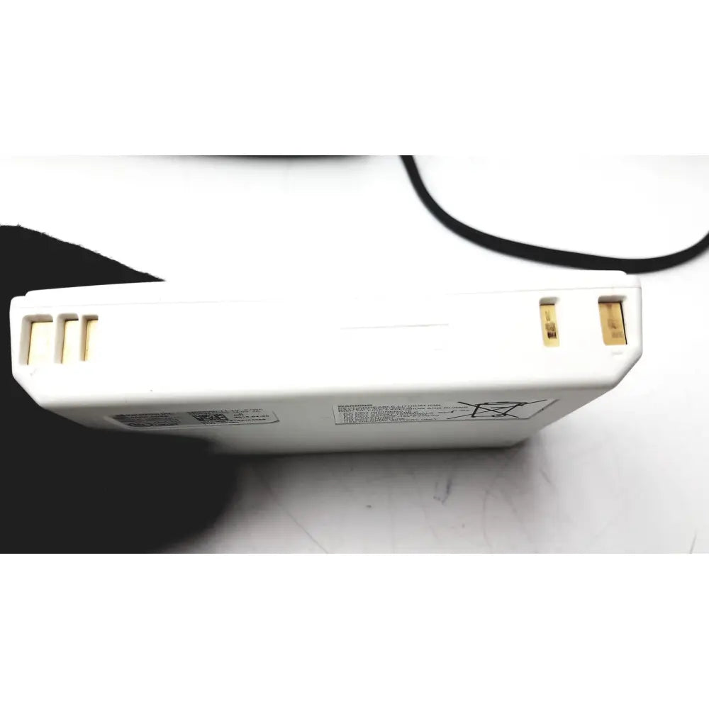 White rectangular battery with gold terminals and warning label for bladderscan charging cradle verathon gpsu15b adapter