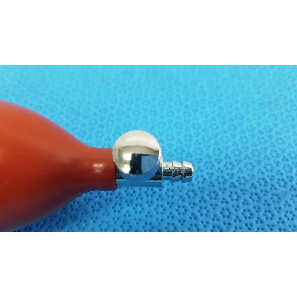Red rubber blood pressure inflation bulb pump with shiny chrome metal nozzle and connector for pressure inflation