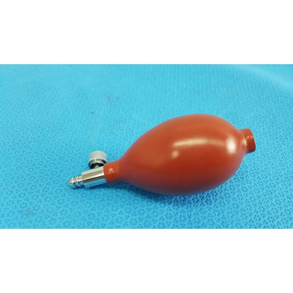 Orange rubber blood pressure inflation bulb pump with metallic valve and threaded connector for pressure inflation use