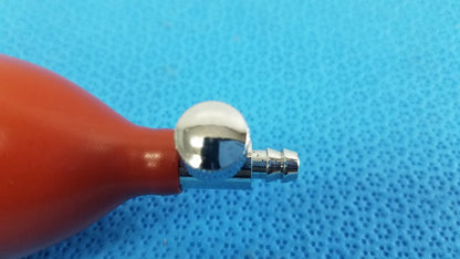 Red rubber blood pressure inflation bulb pump with shiny chrome metal nozzle and connector for pressure inflation