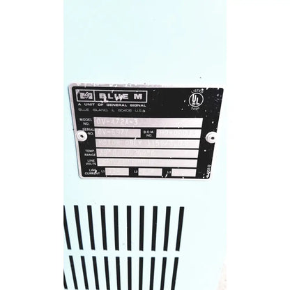 Black metal label with white text on blue m ov-472a-3 constant temperature industrial motor for stabil-therm oven
