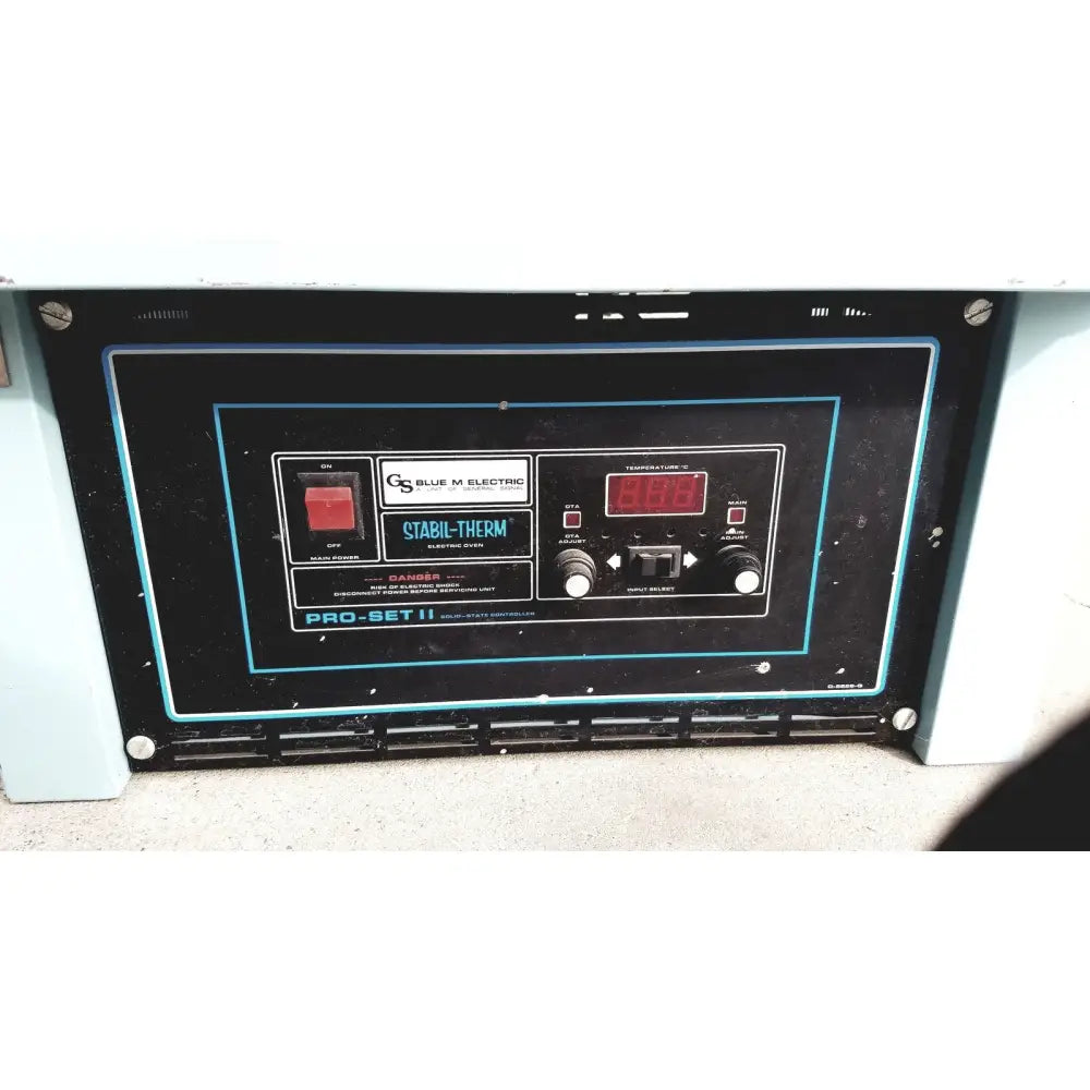 Black control panel with blue trim, red digital display, and white temperature knobs on blue m ov-472a-3 constant temperature oven