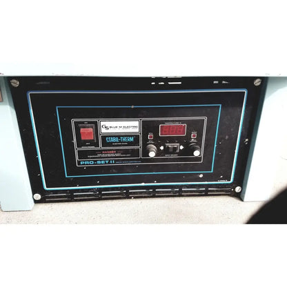Black control panel with blue trim, red digital display, and white temperature knobs on blue m ov-472a-3 constant temperature oven