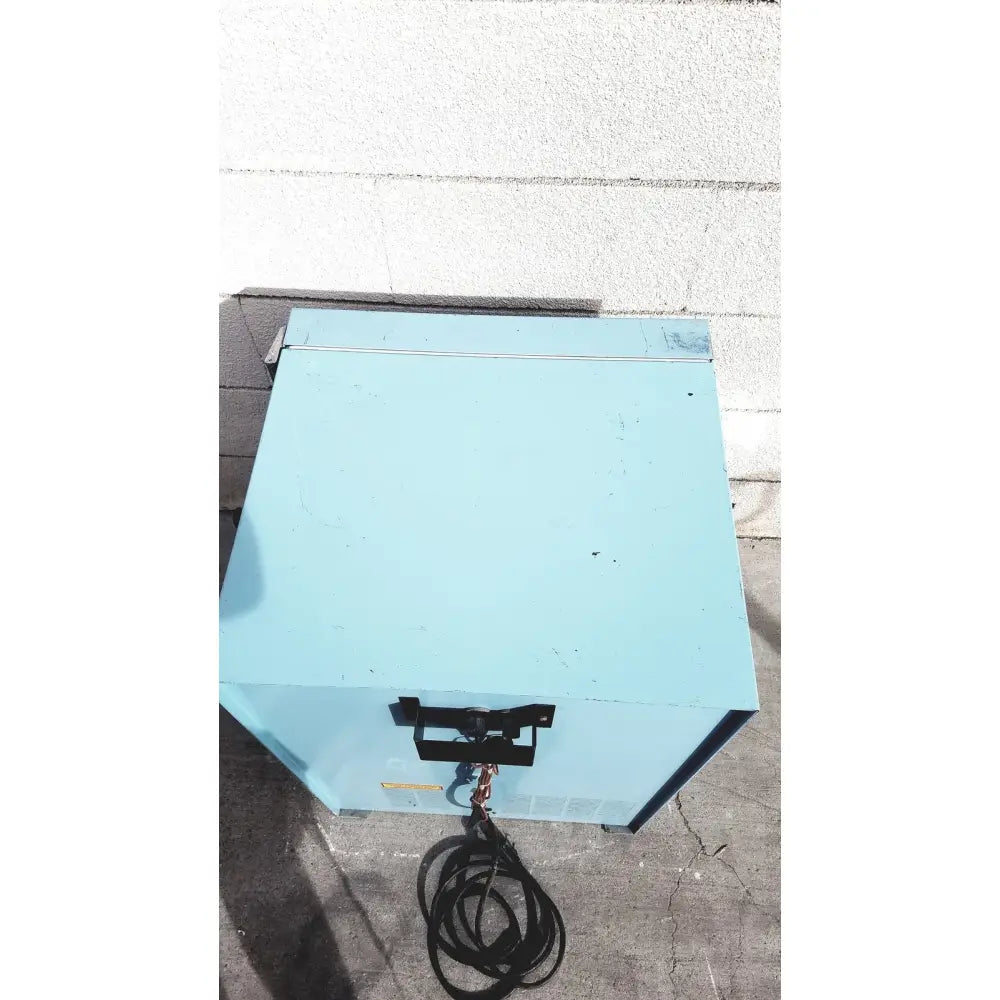 Light blue metal utility box with black handle and coiled cable of blue m ov-472a-3 constant temperature cabinet electric oven