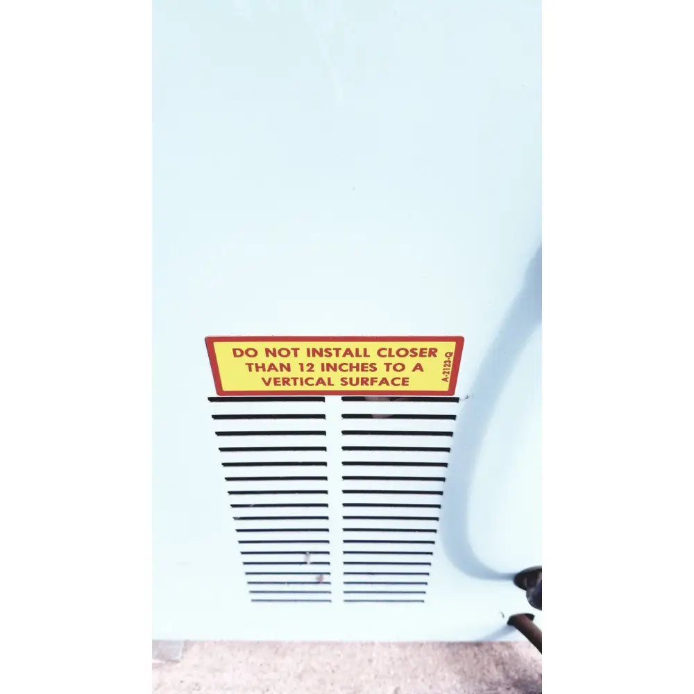 White vent with black slats and yellow warning label on the back of blue m ov-472a-3 constant temperature cabinet electric oven