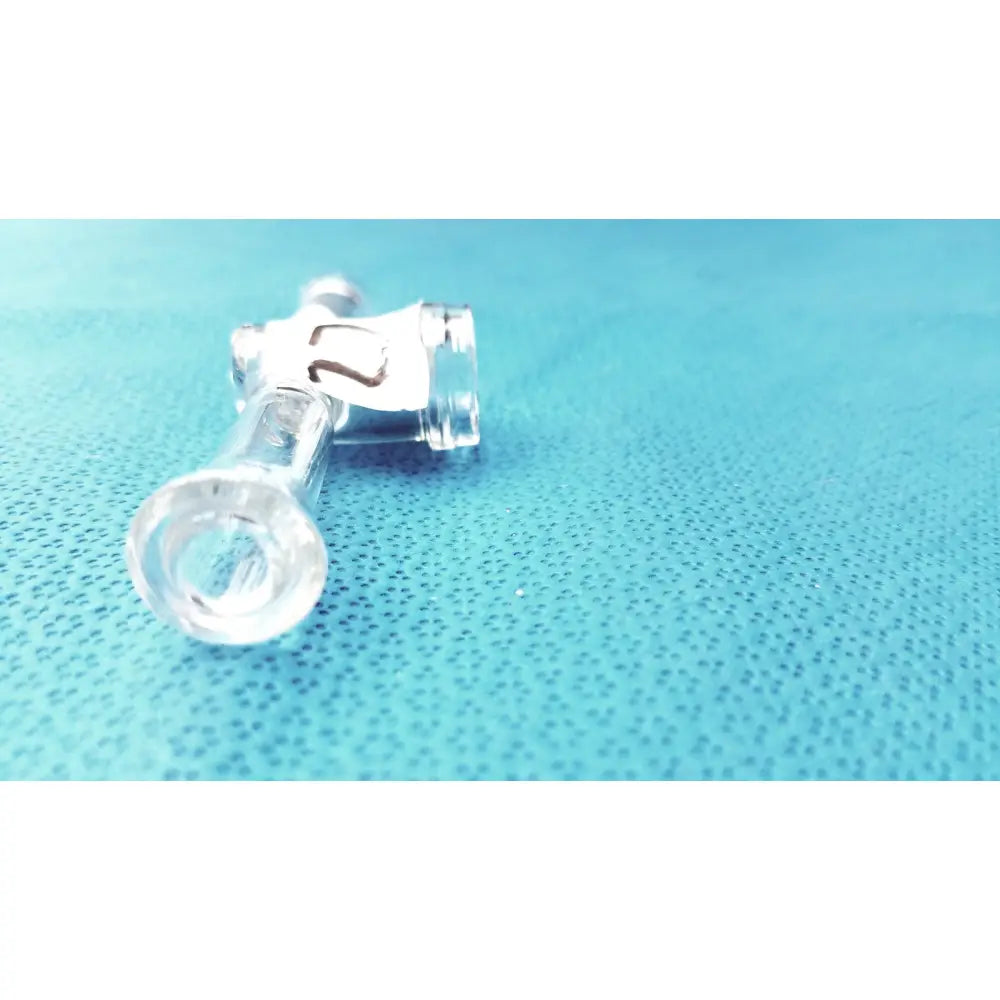 Clear plastic medical tubing connector with white label 2 attached to borosilicate glass stopcock adapter lab valve connector 24/40 joint
