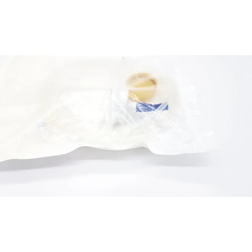 Beige circular Boston Scientific m0068402980 stone catcher medical implant packaged in a clear plastic bag