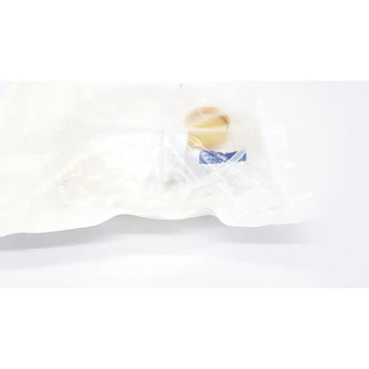 Beige circular Boston Scientific m0068402980 stone catcher medical implant packaged in a clear plastic bag