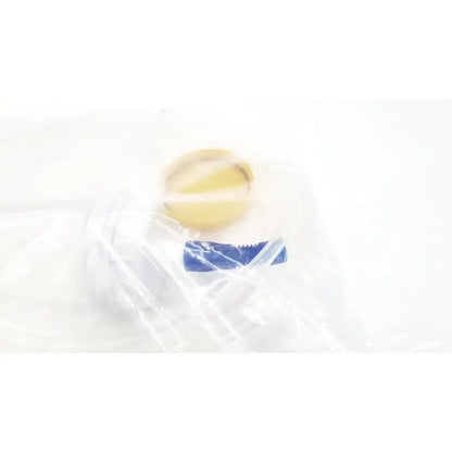 A translucent plastic bag containing a yellow circular scientific m0068402980 stone catcher for boston scientific use