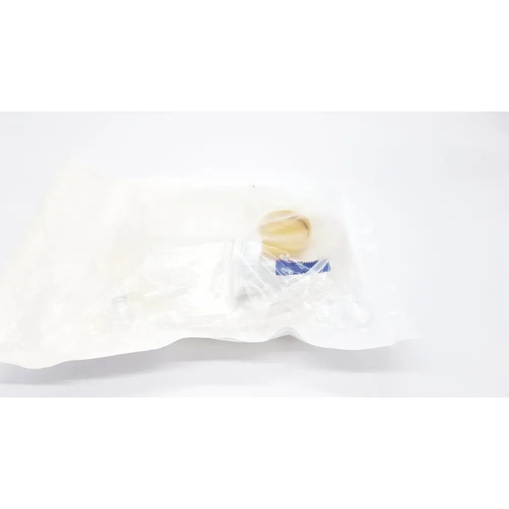 A beige round boston scientific m0068402980 stone catcher with blue label sealed inside clear plastic packaging