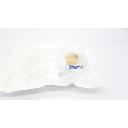 A beige round boston scientific m0068402980 stone catcher with blue label sealed inside clear plastic packaging