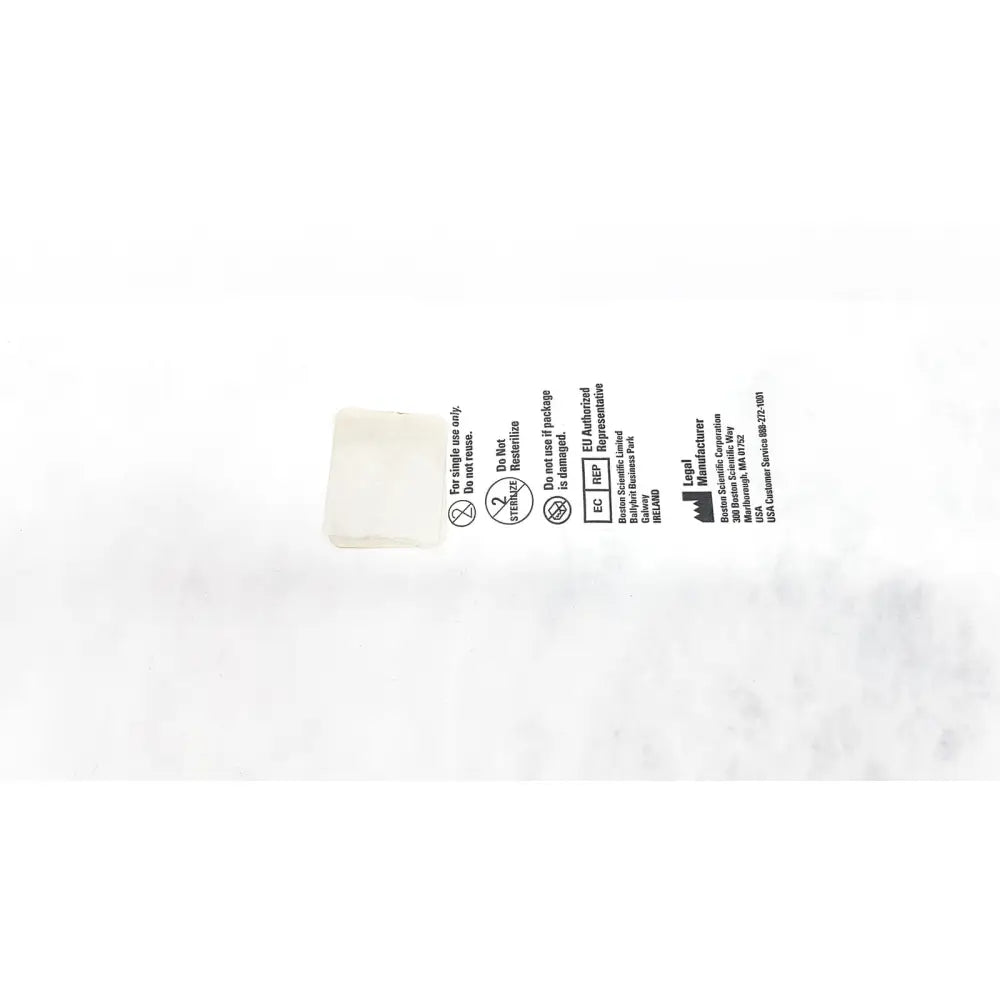 White plastic medical device packaging of boston scientific ureteral dilation system with printed text and symbols