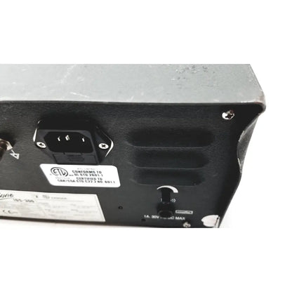Rear panel of black plastic bovie ids-300 electrosurgical generator with three-pronged ac input and certification labels