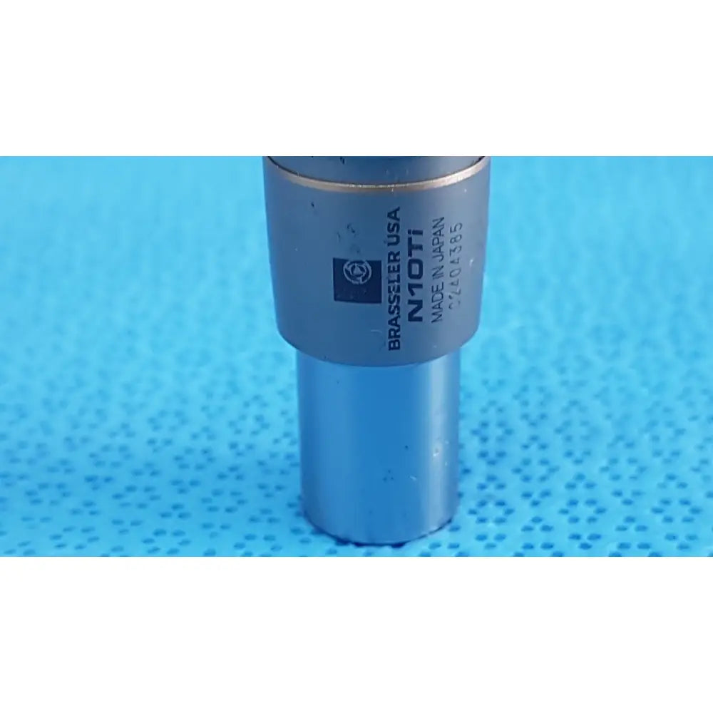 Silver metallic cylindrical microscope objective lens with engraved branding featured in brasseler n10ti led coupler unit