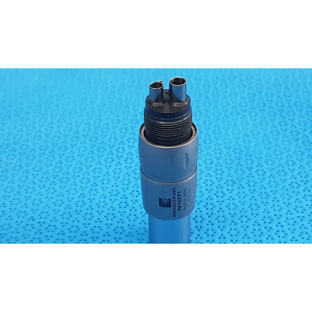 Silver metal brasseler n10ti led coupler with two cylindrical ports and engraved branding for dental handpiece connection