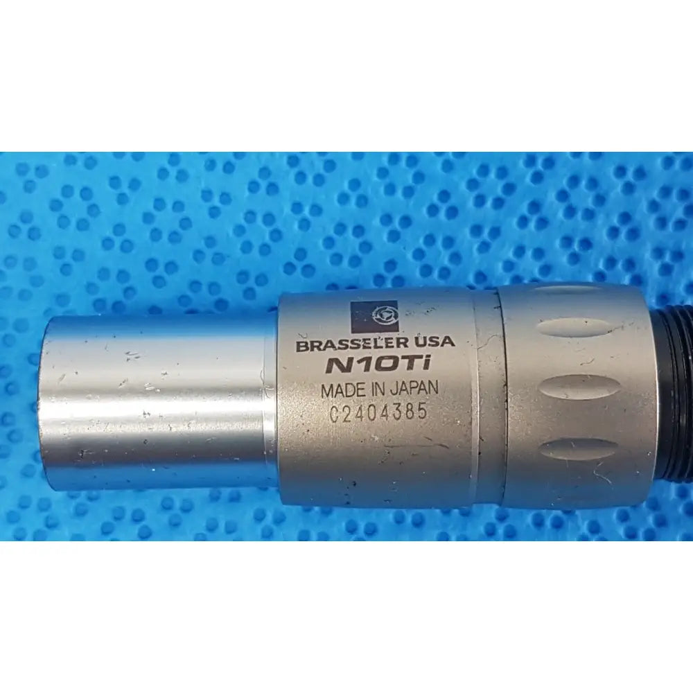 Silver metallic brasseler n10ti led coupler with engraved branding and textured grip for dental handpiece connection unit