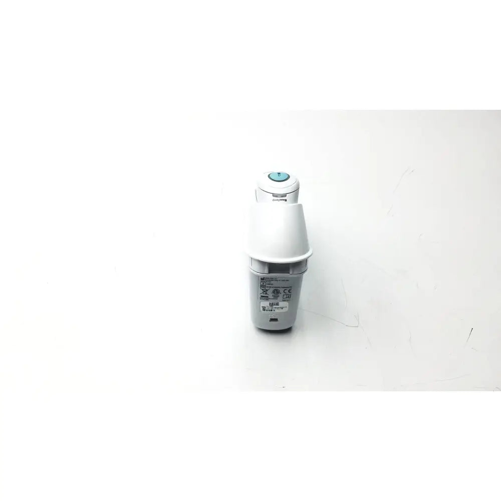 White and gray philips electric toothbrush with light blue button shown alongside braun thermoscan pro ear thermometer ref 901054