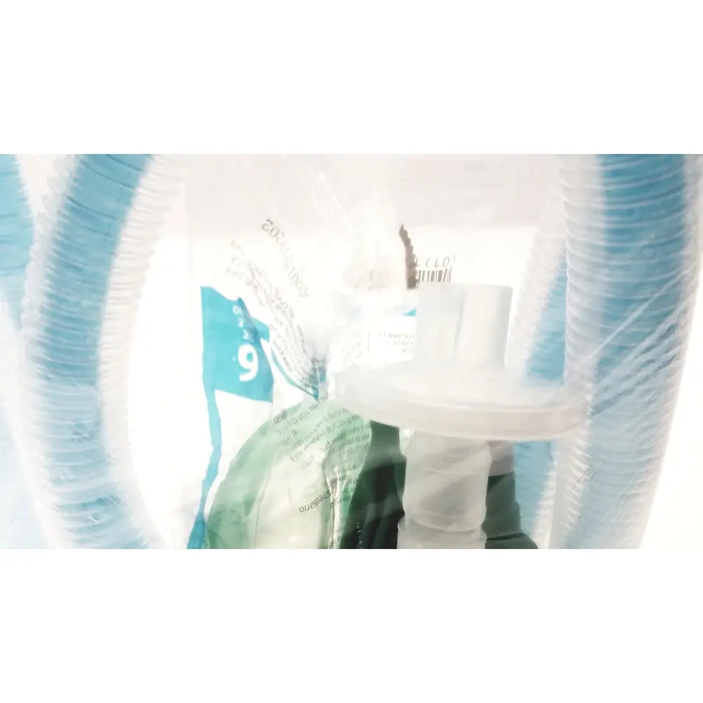 A clear plastic bag containing a white breathing circuit with blue tubing and printed labels breathing bag coaxial device