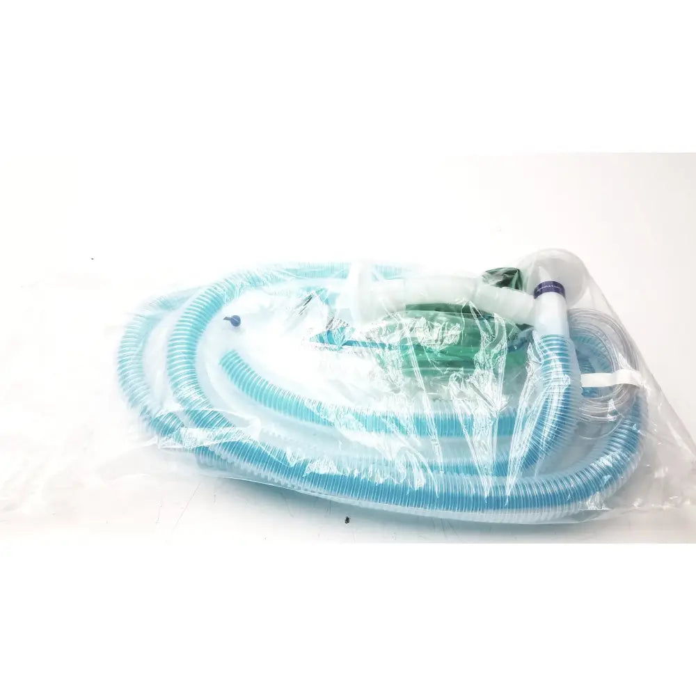 Blue corrugated plastic breathing circuit with clear face mask and white connectors in bag coaxial circuit packaging