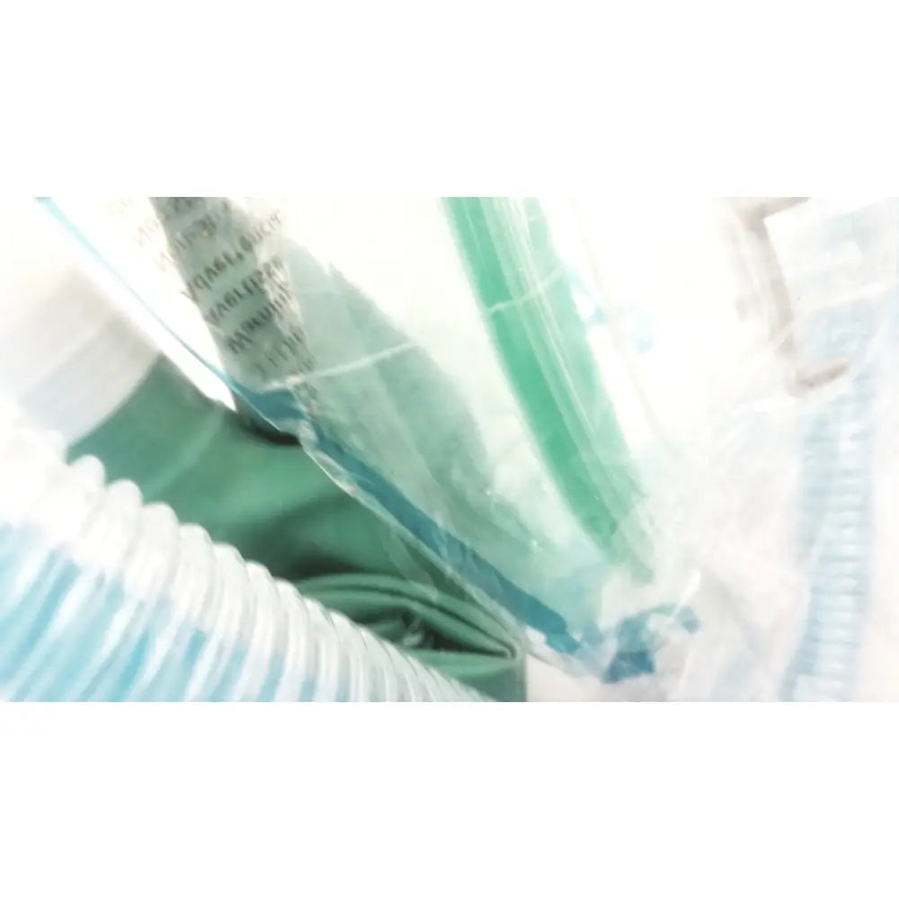 Green medical oxygen mask with clear plastic packaging in a breathing bag coaxial circuit breathing circuit product