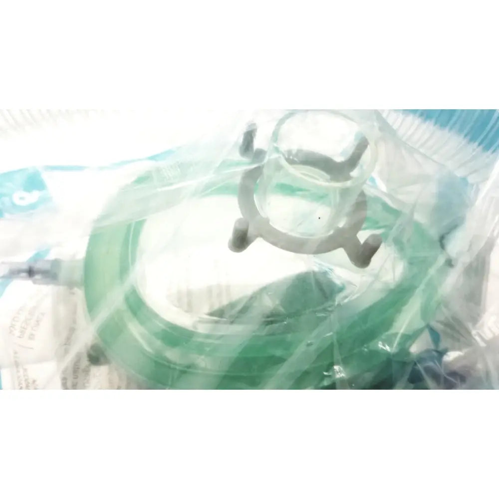 Green silicone breathing circuit face mask with clear plastic frame and gray adjustable straps for bag coaxial circuit