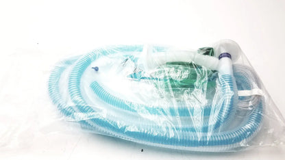 Blue corrugated plastic breathing circuit with clear face mask and white connectors in bag coaxial circuit packaging